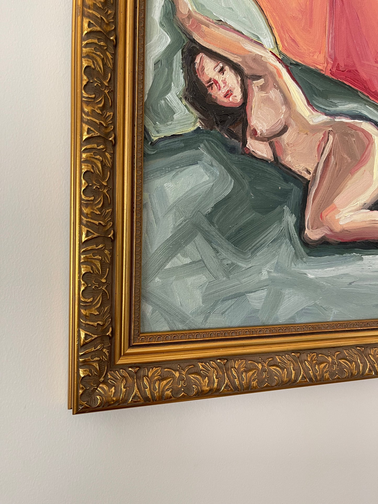 Nude woman on green sheets