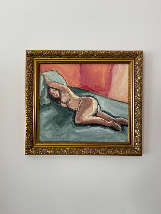 Nude woman on green sheets
