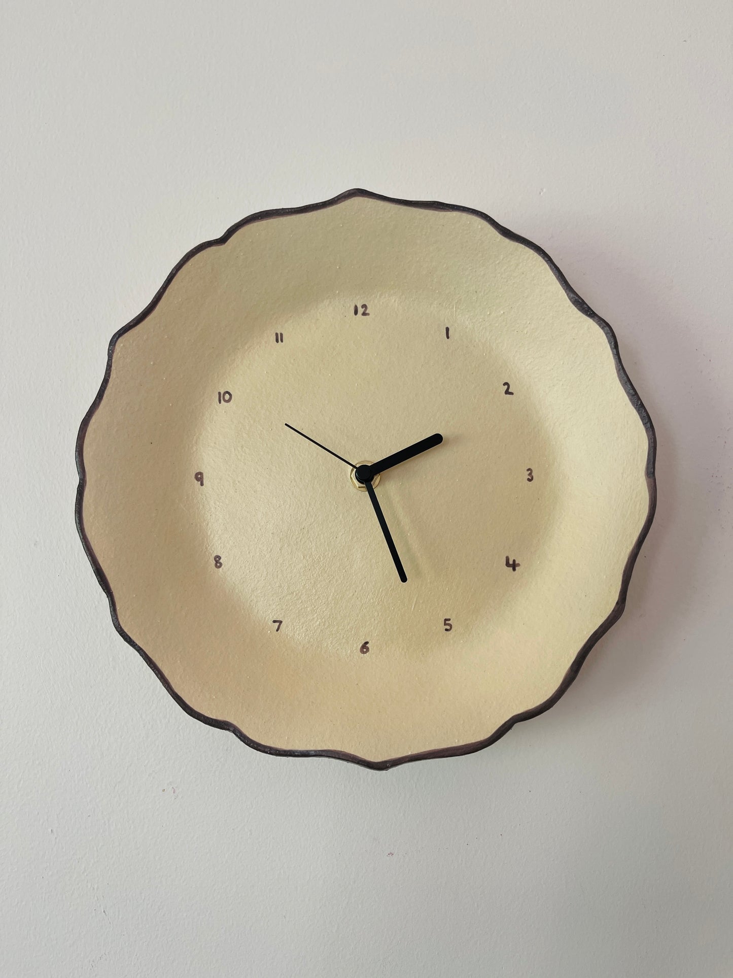 Beige ceramic clock with brown trim
