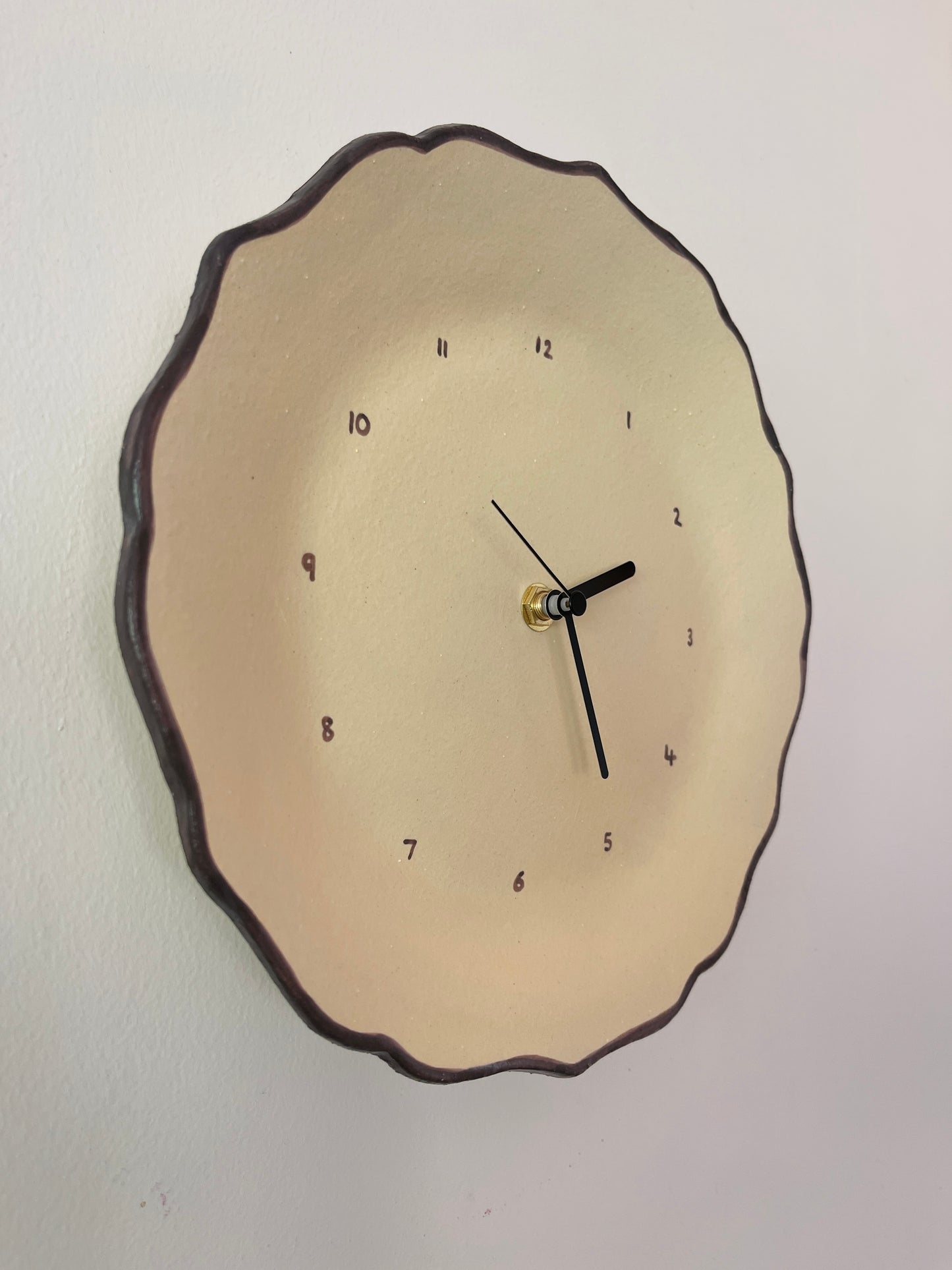 Beige ceramic clock with brown trim
