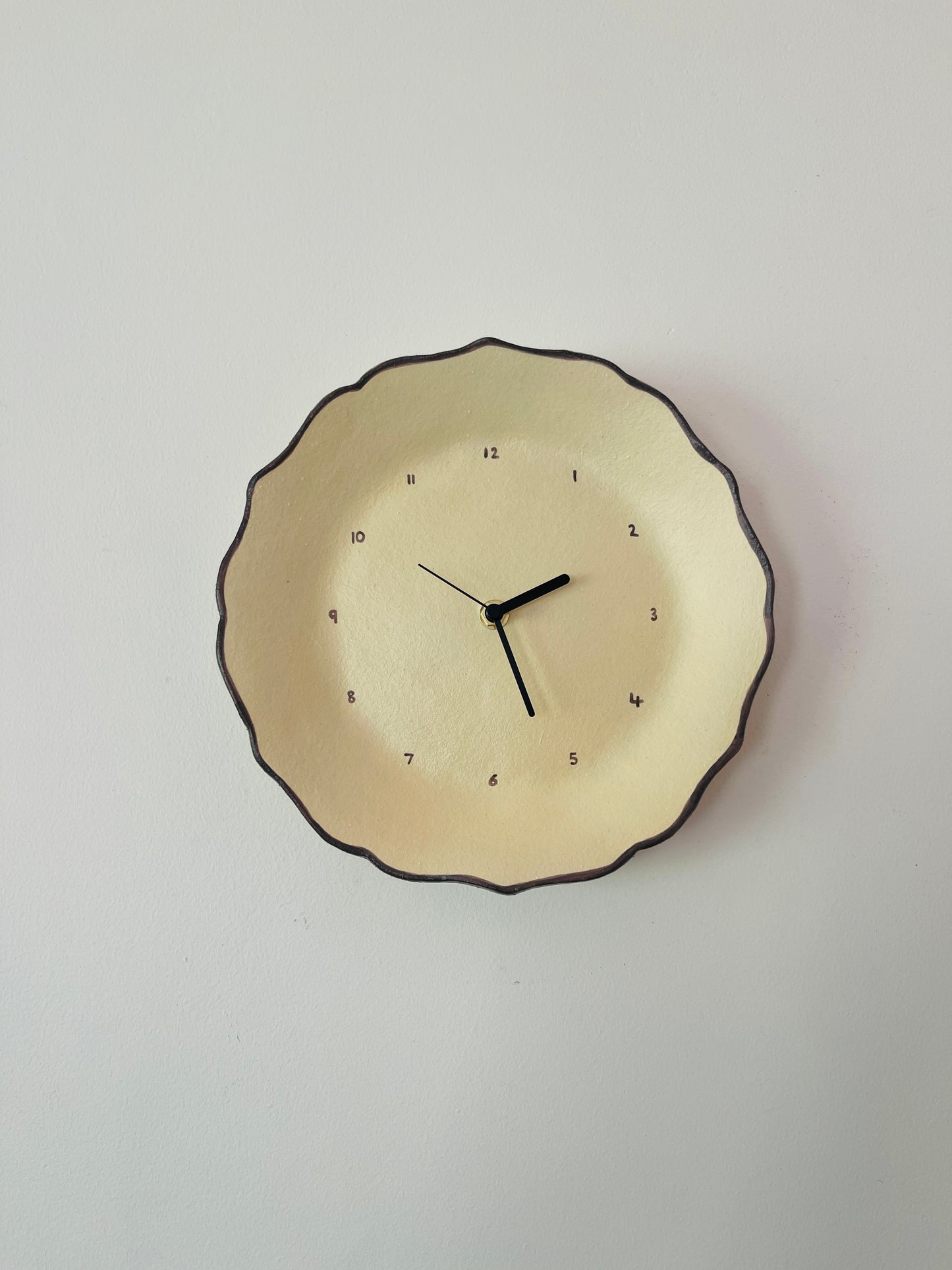 Beige ceramic clock with brown trim