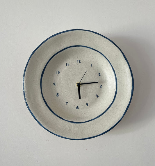 Ceramic clock with blue trim