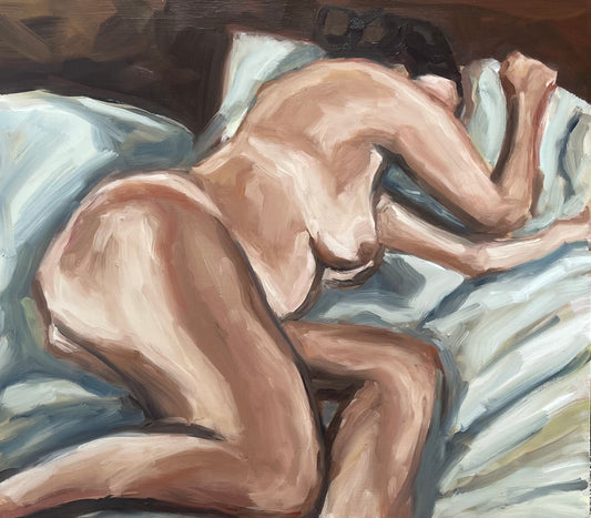 Nude woman, blue sheets